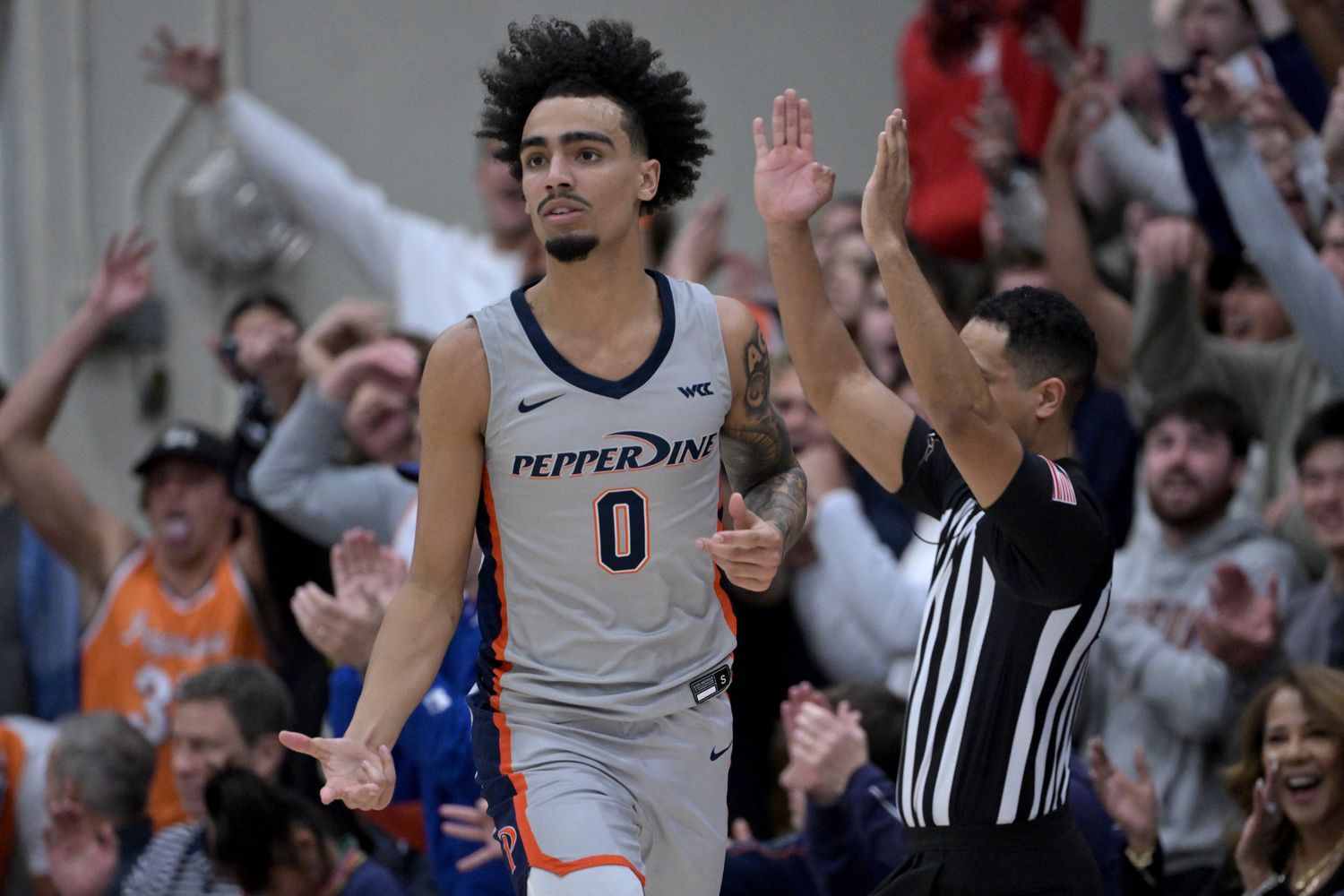 Jan 18, 2024; Malibu, California, USA; Pepperdine Waves guard Houston Mallette (0) heads down court after a 3-point basket in the first half at Firestone Fieldhouse. Mandatory Credit: Jayne Kamin-Oncea-USA TODAY Sports  